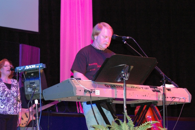 Joey Nicholson worshiping on keyboard